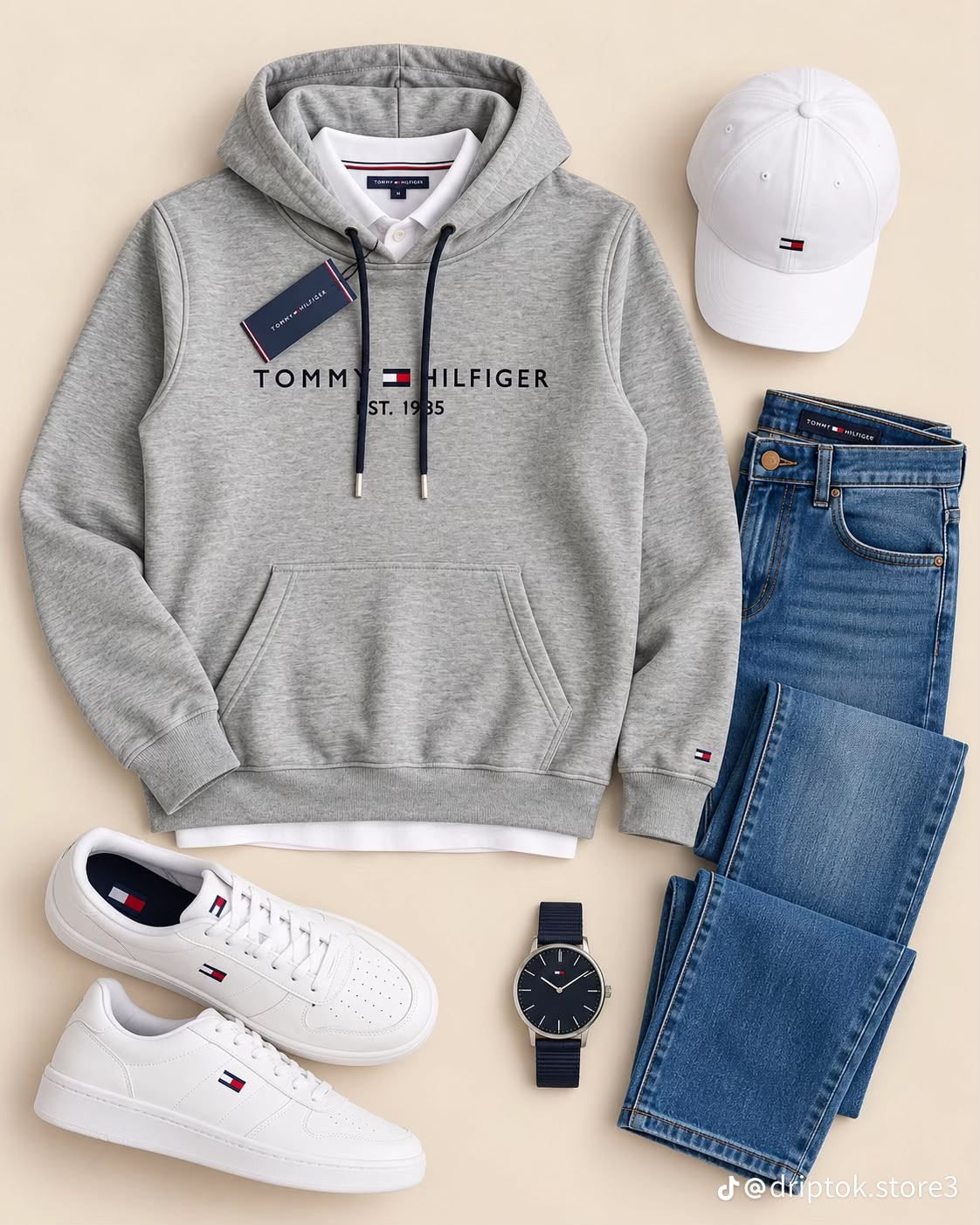 Referencia visual: Polerón gris, jeans azules y accesorios blancos.